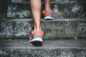 patient running up stairs with orthotics.